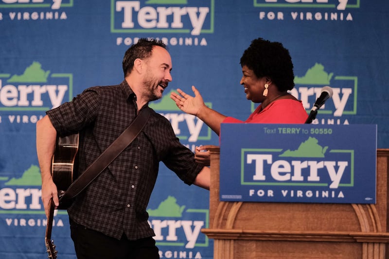 Musician Dave Matthews greets voting rights activist Stacey Abrams during a get-out-the-vote rally. Getty Images / AFP