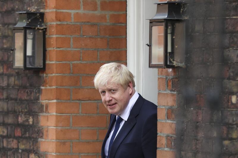 Boris Johnson, former U.K. foreign secretary, second right, departs from an office in the Westminster district of London, U.K., on Monday, July 22, 2019. Boris Johnson and Jeremy Hunt are battling to replace Theresa May as leader of the Conservative Party and British prime minister. Photographer: Simon Dawson/Bloomberg