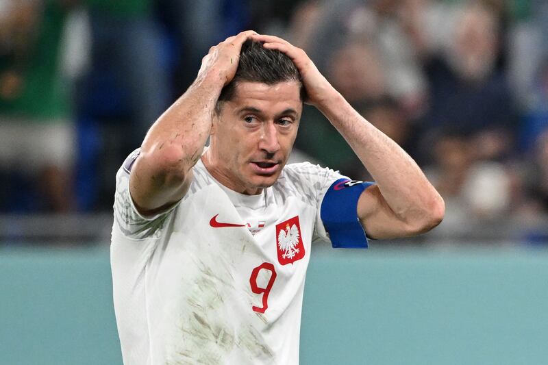 Poland striker Robert Lewandowski after missing a penalty during the World Cup draw against Mexico at Stadium 974 in Doha on November 22, 2022. AFP