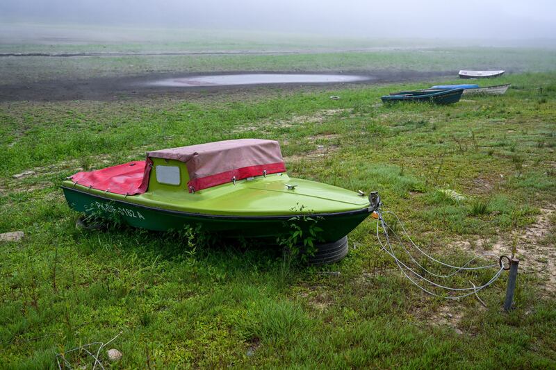 A boat sits on the exposed bottom of Lake Solina, in south-eastern Poland. The lack of rainfall has caused the water level in the lake to recede. EPA 
