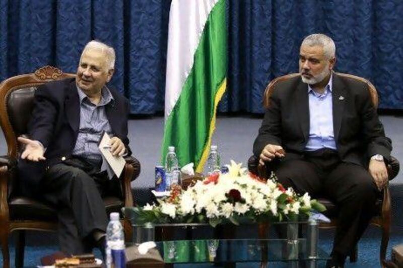 The Palestinian central elections commission chairman, Hanna Nasser, left, and the Hamas prime minister, Ismail Haniya, meet in Gaza City on Monday to prepare the way for long-overdue elections, a major step toward repairing a five-year rift between the two territories.