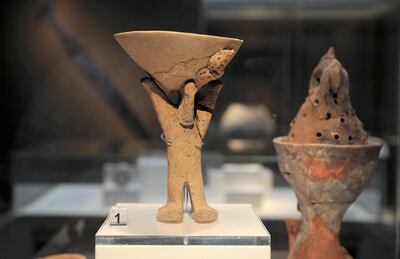 SHARJAH , UNITED ARAB EMIRATES , OCT 18   – 2017 :- Ceramic incense burner of standing man with raised arms, Bithnah , BIT.44-486 on display during the exhibition of 40 Years of Archaeological Cooperation Between The United Arab Emirates and France held at Sharjah Archaeology Museum in Sharjah. (Pawan Singh / The National) Story by John Dennehy