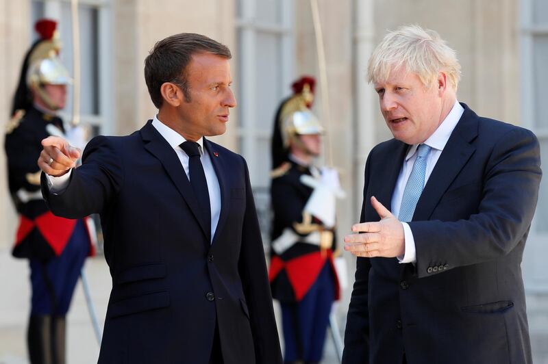 French President Emmanuel Macron welcomes British Prime Minister Boris Johnson before a meeting on Brexit at the Elysee Palace in Paris, France, August 22, 2019. REUTERS/Gonzalo Fuentes