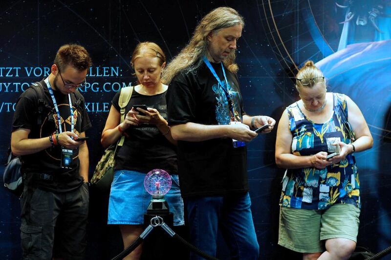 Visitors attend the Gamescom fair. Ralph Orlowski / Reuters