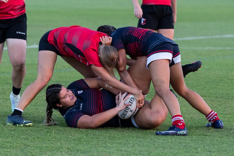 A Dubai College player is tackled. Ruel Pableo for The National