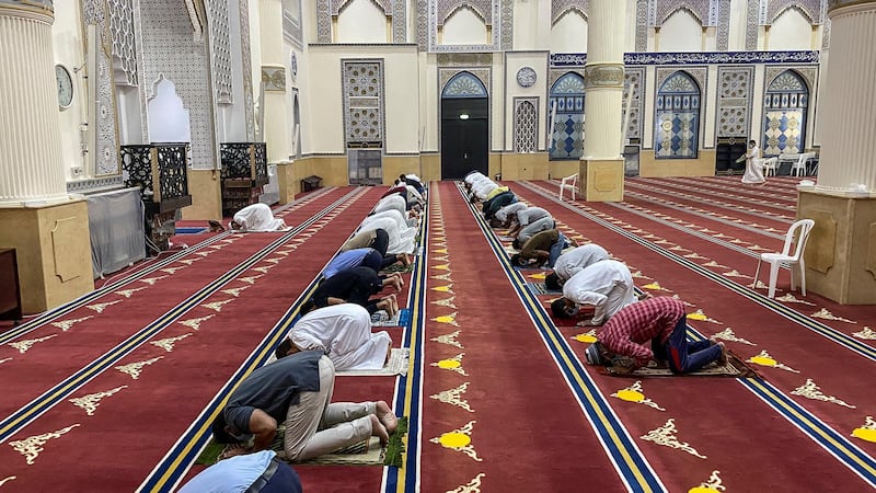 DUBAI, UNITED ARAB EMIRATES. 13 APRIL 2021. Evening prayer at the end of the first day of fasting of the Holy Month of Ramadan in the United Arab Emirates at the Al Farooq Omar Bin Al Khattab Mosque. (Photo: Antonie Robertson/The National) Journalist: None. Section: National.