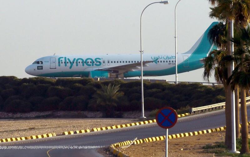 A Flynas plane taxies on the tarmac at the King Khalid International Airport in Riyadh. The low cost carrier modified an existing order adding 10 more aircraft which pushes the value to more than $10 billion. AFP