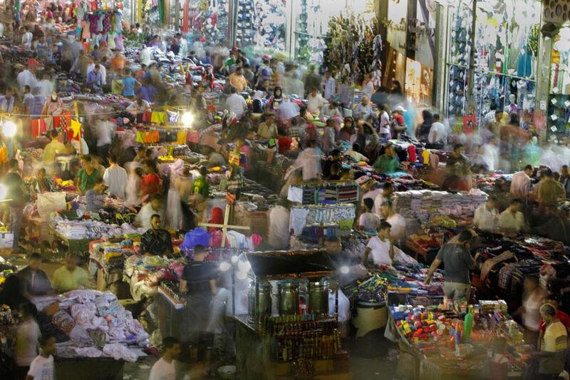 Egyptians shopping at a popular market to mark Eid Al Fitr holiday in Cairo, Egypt. Amr Nabil / AP Photo