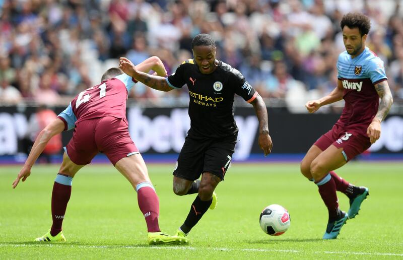 Sterling looks to make a break for City. Getty