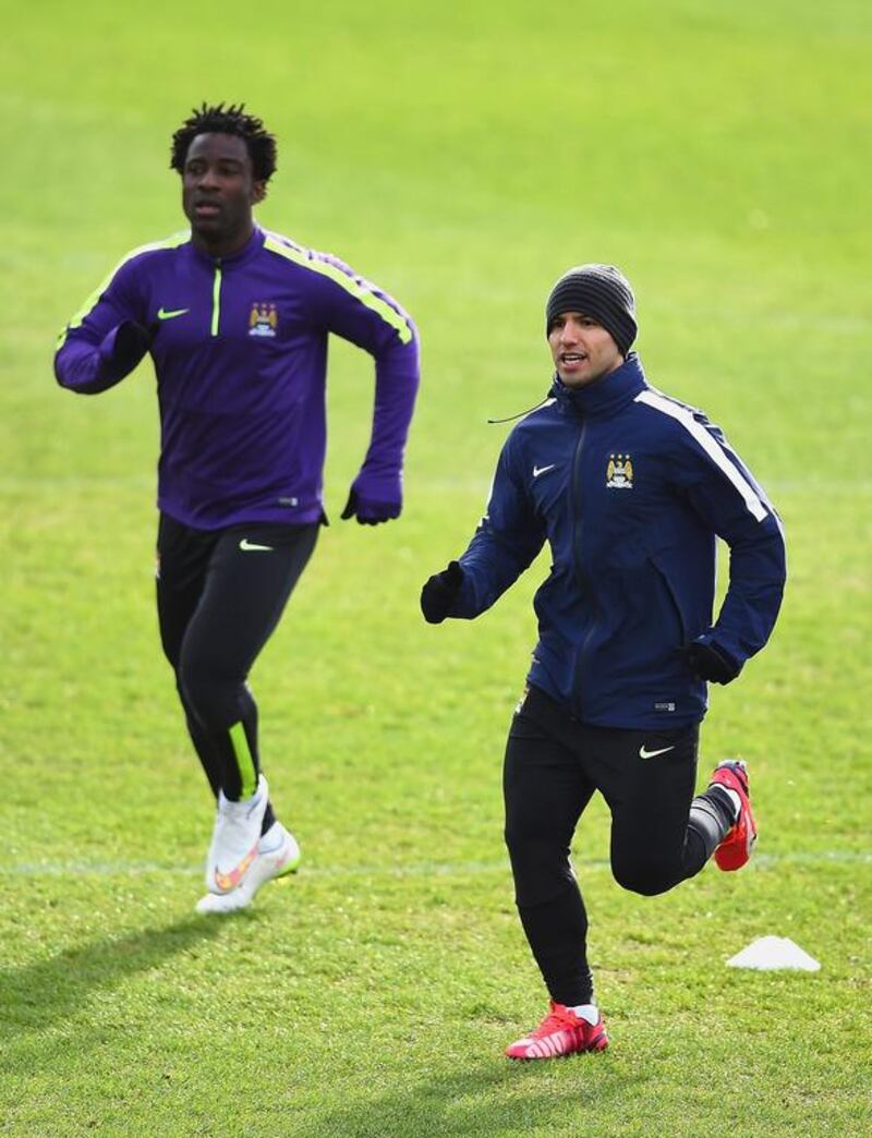 Wilfred Bony runs with Sergio Aguero of Manchester City during their team training session for Tuesday's Champions League last 16 first leg match against Barcelona. Laurence Griffiths / Getty Images