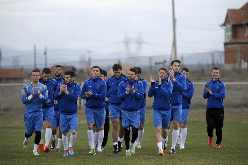 During a training session at Obilic on Monday, the Kosovo’s national football team players show their pleasure at finally getting a chance to play a Fifa-sanctioned friendly. Kosovo are gearing up for their Fifa debut on the international scene by hosting Haiti at Mitrovica, 24 miles north of the capital, Pristina, the first in their six-year history as an independent state. Armend Nimani / AFP

