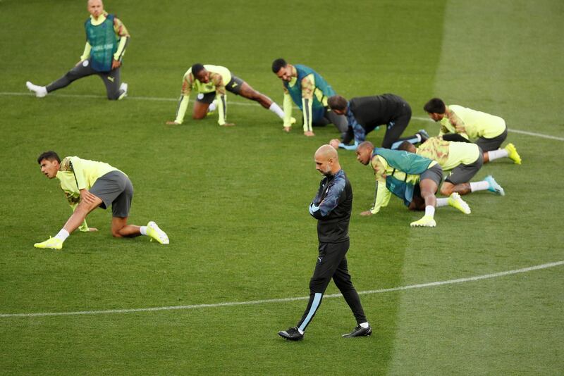 Manchester City manager Pep Guardiola and the players during training. Reuters