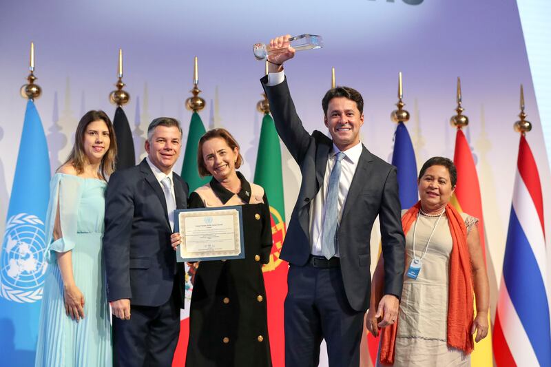 Mayor Anderson Ferreira, Mayor of Jaboatão dos Guararapes holds up his award with his team at the United Nations Public Service Awards, Dubai. Khushnum Bhandari / The National