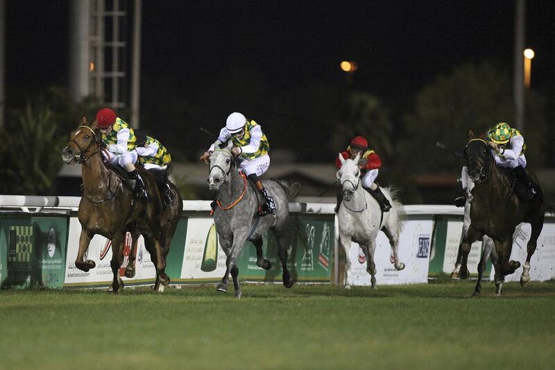 Rakha, left, pictured being ridden by Silvestre de Sousa on February 2, 2014, is the defending champion in the Liwa Oasis Group 1 race. Lee Hoagland / The National