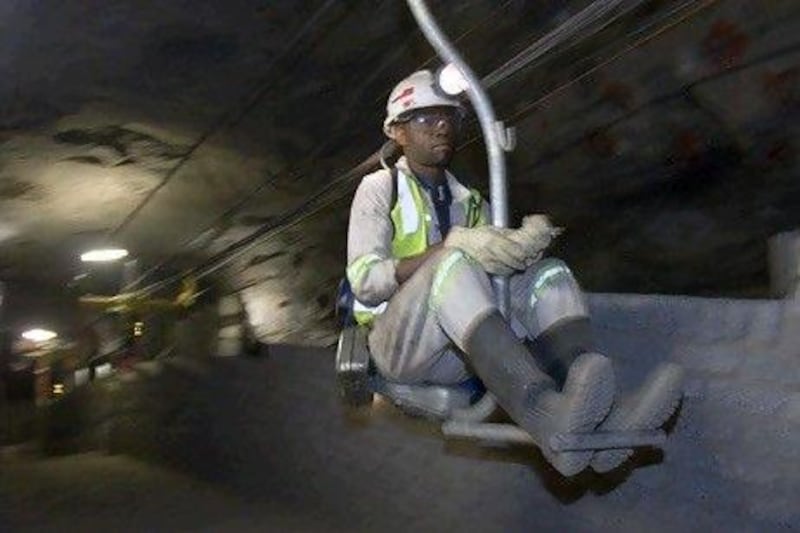 A miner goes to work in an Xstrata mine in South Africa. The Swiss mining company is planning to merge with Glencore. Xstrata via Bloomberg News