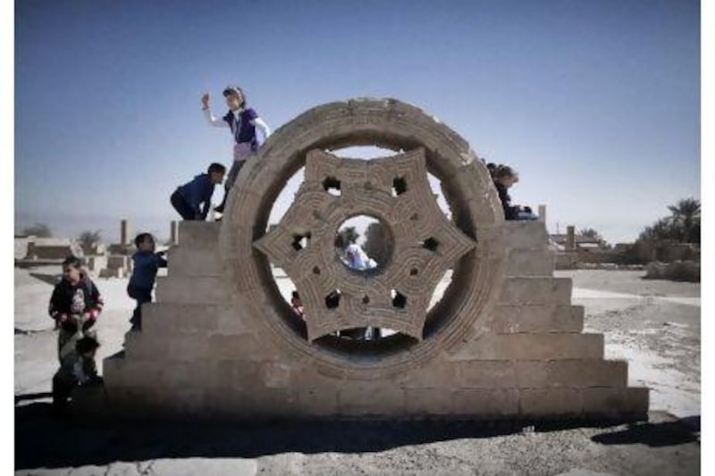 Children play at the site of Hisham's Palace in the West Bank, near Jericho. It and many other important archaeological sites in the Middle East are in need of repair and preservation.