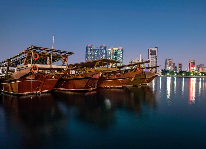 The sun goes down over Abu Dhabi's Dhow Harbour. Victor Besa / The National