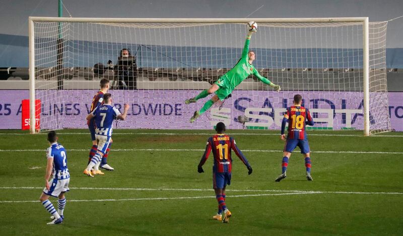 Barcelona goalkeeper Marc-Andre ter Stegen makes a save from Real Sociedad's Joseba Zaldua. Reuters