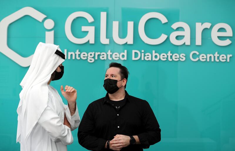 41-year-old Austrian John Duval speaks with Dr Ihsan Almarzooqi, co founder and managing director of GluCare. John found out he had undiagnosed diabetes when he was fighting Covid-19. He introduced lifestyle changes and is now in remission. Pictured at GluCare in Dubai on April 22nd, 2021. Chris Whiteoak / The National. 
Reporter: Nick Webster for News