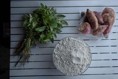 Sweet potatoes, maize-meal flour and a herb known as Murenda (jute mallow), used to prepare the national staple, Ugali (consumed for generations by the Luhya-speaking community), in Kenya, Nairobi, on December 16, 2021. AFP