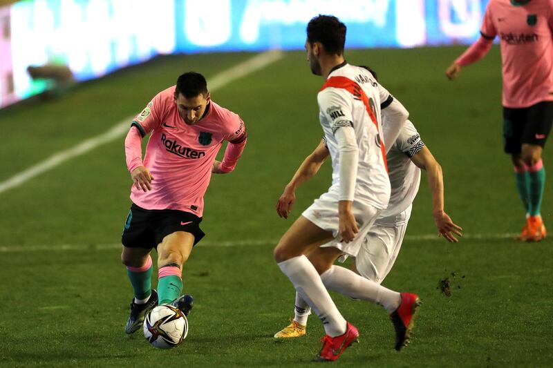 Rayo Vallecano's defender Ivan Martos takes on Barcelona's striker Lionel Messi during the Copa del Rey at Estadio de Vallecas. EPA