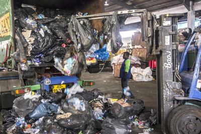 A forklift assists in unloading trash from a truck at a recycling facility operated by Impetus Conceptus Pte. in Singapore, on Friday, June 28, 2019. Humans generated 2.01 billion tons of solid waste in 2016 and by 2050, that could rise to 3.4 billion tons, according to the World Bank. Photographer: Ore Huiying/Bloomberg