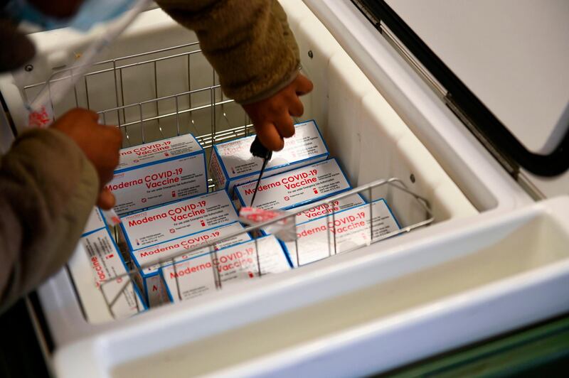 In a handout photo taken and released by US Forces Korea, medical service members unload doses of the Covid-19 coronavirus vaccine at Osan Air Base, south of Seoul. AFP
