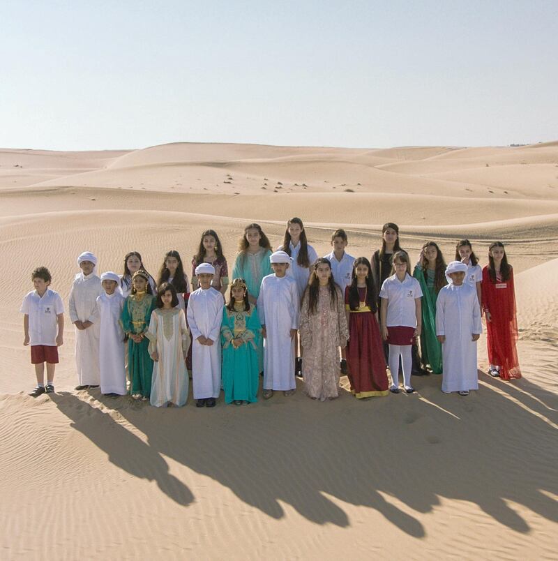 Children from the Raffles World Academy Choir perform in the Dubai Desert.    
