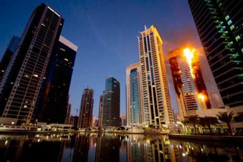 The residential tower in Jumeirah Lakes Towers on fire during the blaze which left hundreds homeless. Kaveh Kashani / AP Photo