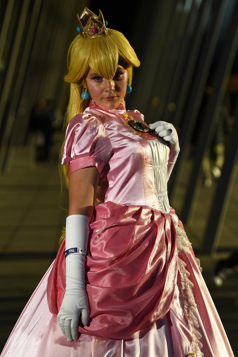 One lady dresses up as Princess Peach, a character from Nintendo's Mario franchise.  EPA
