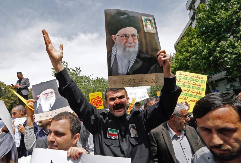 Iranian demonstrators raise placards and a portrait of Iran's Supreme Leader Ayatollah Ali Khamenei as they chant anti-US slogans during a rally in the capital Tehran, on May 10 2019.  Iranian foreign minister blamed the EU for the decline of Tehran's nuclear accord with world powers and insisted the bloc "should uphold" its obligations under the pact in which Iran agreed to curb its nuclear ambitions in return for sanctions relief.
US President Donald Trump pulled the United States out of the agreement in May of last year and reinstated unilateral economic sanctions.
 / AFP / afp / STR
