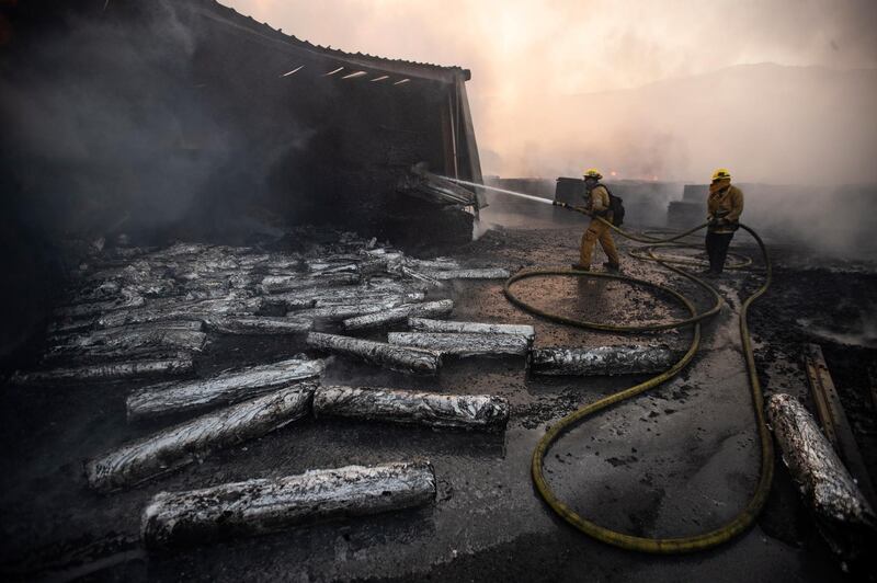Firefighters work at extinguishing the Tick Fire in a factory near Santa Clarita. EPA