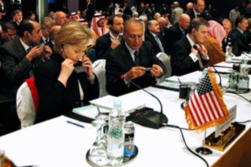 Hillary Clinton, left, and the Ahmed Aboul Gheit, second from left, attend the Gaza reconstruction conference in Egypt, on March 2 2009.