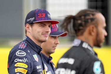 File photo dated 15-07-2021 of Red Bull Racing's Max Verstappen talks with Mercedes driver Lewis Hamilton. Those Formula One fans who were never happy with the way Max Verstappen snatched the 2021 title away from Lewis Hamilton at the end of last season were given another reason to add an asterisk to the result in October when Red Bull were deemed guilty of breaching cost caps last year. Issue date: Friday December 16, 2022.