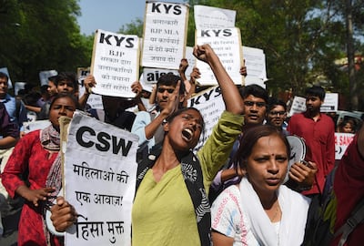 (FILES) In this file photo taken on April 12, 2018 Indian activists and students hold placards and shout slogans during a protest against alleged political silence over the rape of a child near Jammu and a rape case in Uttar Pradesh state, in New Delhi.
The brutal gang rape and murder of an eight-year-old girl triggered nationwide outrage in India on April 13 that put the authorities under new pressure over the scourge of sexual crimes.  
 / AFP PHOTO / Sajjad HUSSAIN