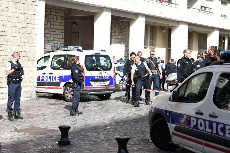 Police gather at the site where a car slammed into soldiers on patrol in Levallois-Perret. Stephane De Sakutin.