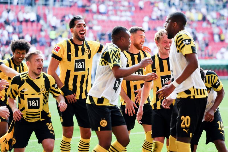 Borussia Dortmund players celebrate their win over Augsburg. EPA