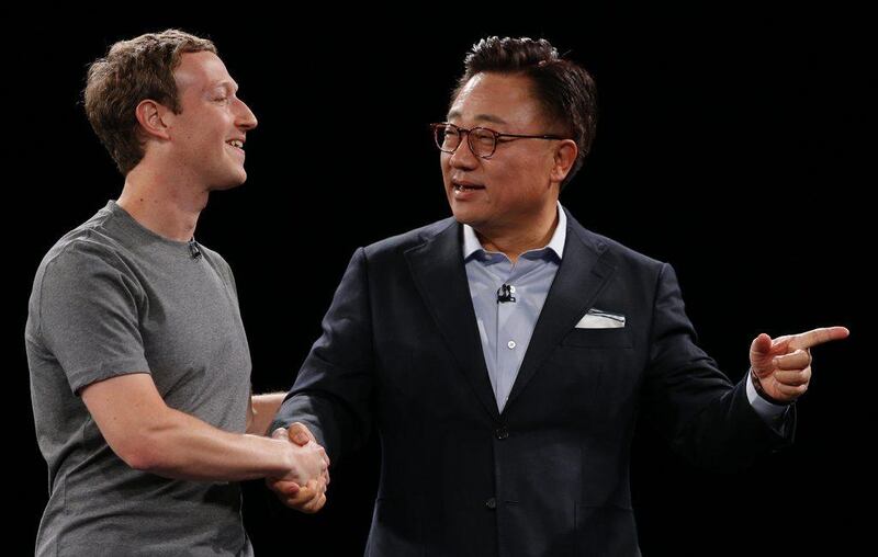 DJ Koh, president of Mobile Communications Business, Samsung Electronics, right, shakes hands with Facebook CEO Mark Zuckerberg during the Samsung Galaxy Unpacked 2016 event on the eve of this week’s Mobile World Congress wireless show, in Barcelona, Spain, on Sunday, February 21, 2016. Zuckerberg was there to announce a partnership with the South Korean firm to promote the use of virtual reality on the social network. "We want to make Facebook the best video platform for virtual reality and Samsung is the only company in the world that can provide a good experience in terms of virtual reality," he said. AP Photo / Manu Fernadez