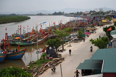 Fishing boats are berthed along a river in Nghe An province, Vietnam. Portfolio inflows to emerging markets slowed down in October from a month ago as trade tensions create uncertainty. AFP.