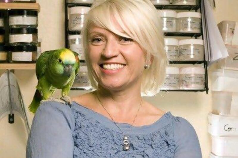 Rowena Bird with her pet parrot, Mary.
