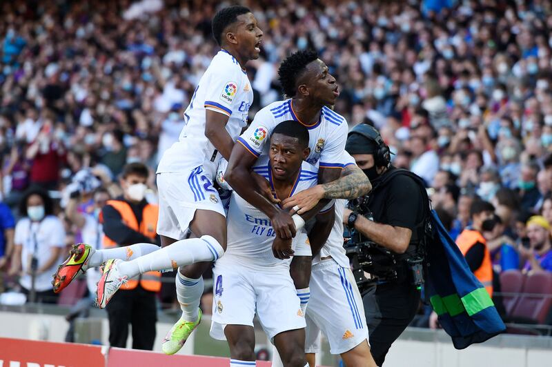 David Alaba (C) celebrates with teammates after scoring the opening goal. AFP