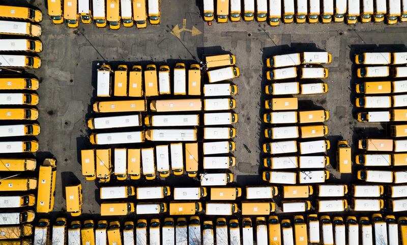 Buses fill a parking area after all schools in the area were closed, in Freeport, New York, US. EPA