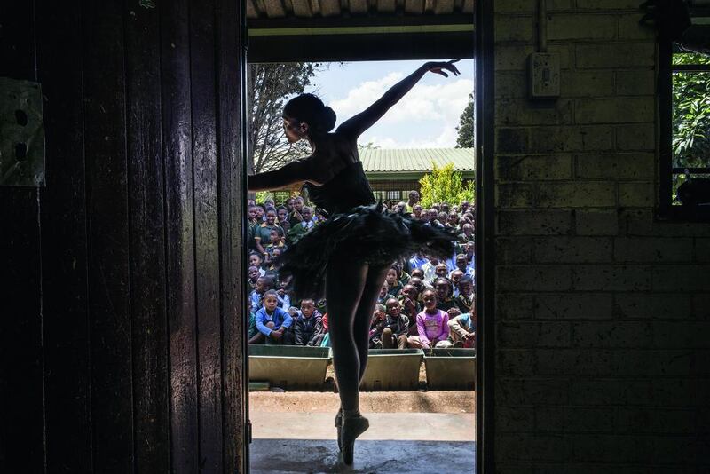 Senior soloist of the Joburg Ballet Kitty Phetla performs in a classroom at the Nka-Thuto Primary School in Soweto on October 16. Using ballet and dance to promote healthy and positive choices, Joburg Ballet provided lecture demonstrations to 20 schools in Soweto, raising awareness and informing students of the available free classes they provide together with the provincial department of education.  Marco Longari / AFP