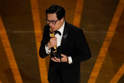 Ke Huy Quan accepts the award for best performance by an actor in a supporting role for Everything Everywhere All at Once. AP