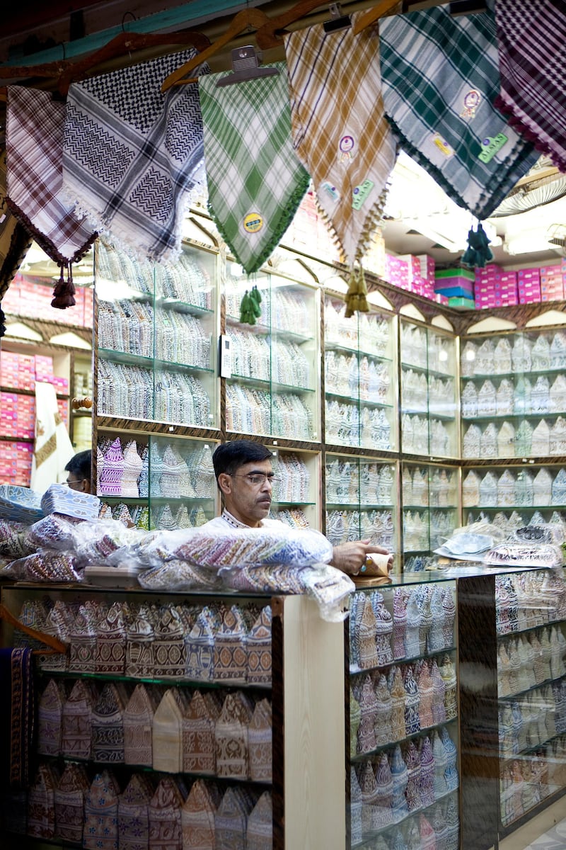 A shopkeeper works in his store selling kumas, the traditional Omani male hats, in the historic Mutrah Souk in downtown Muscat, the capital of the Sultanate of Oman on Wednesday, Oct. 12, 2011. (Silvia Razgova / The National)

