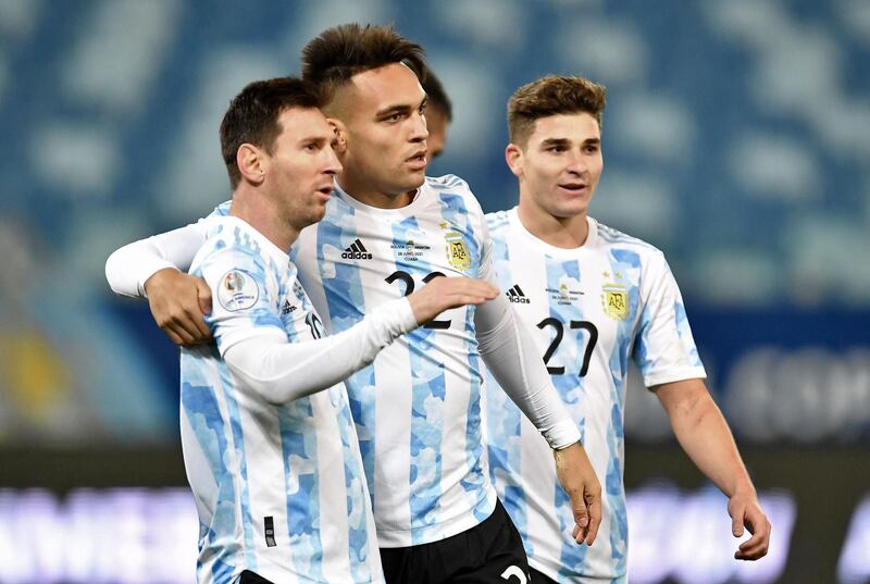 Argentina's Lautaro Martinez celebrates with Lionel Messi after scoring against Bolivia. AFP