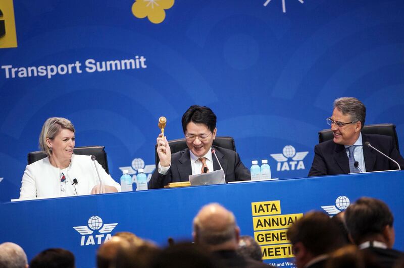 Walter Cho, president of Korean Air Lines , centre, hits a gavel during the IATA annual general meeting in Seoul, South Korea. Bloomberg