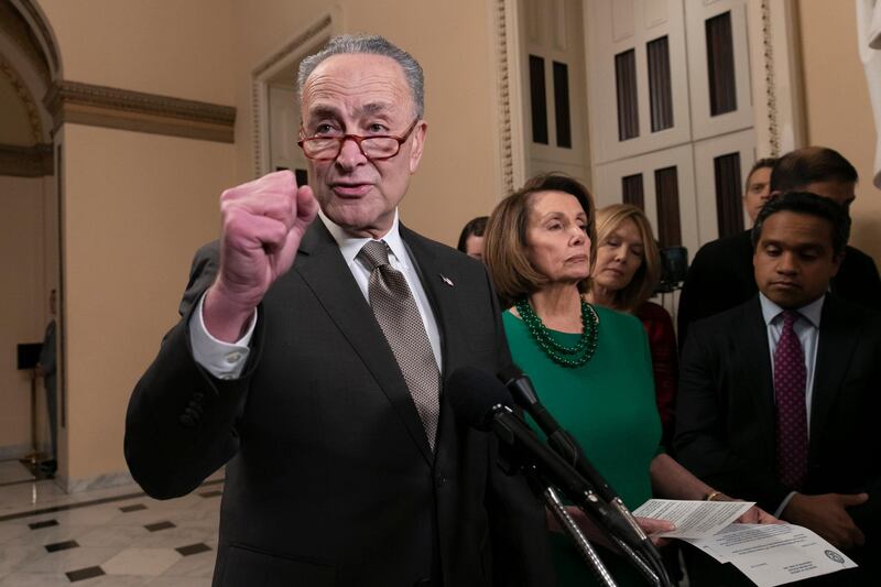 Senate Minority Leader Chuck Schumer, D-N.Y., and House Democratic Leader Nancy Pelosi of California, the speaker-designate for the new Congress, talk to reporters as a revised spending bill is introduced in the House that includes $5 billion demanded by President Donald Trump for a wall along the U.S.-Mexico border, as Congress tries to avert a partial shutdown, in Washington, Thursday, Dec. 20, 2018. (AP Photo/J. Scott Applewhite)