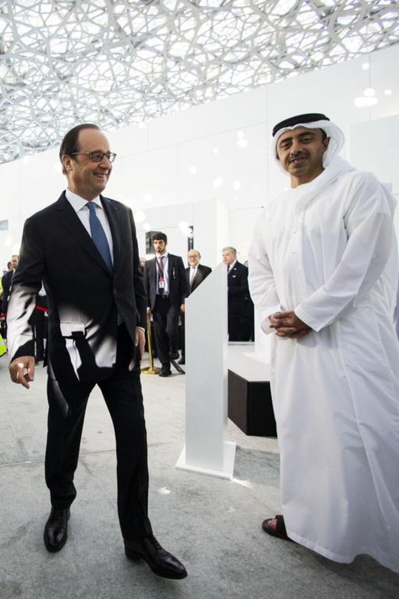 Sheikh Abdullah bin Zayed, Minister of Foreign Affairs, tours the Louvre Abu Dhabi construction site with French president Francois Hollande in December. Christopher Pike / The National
