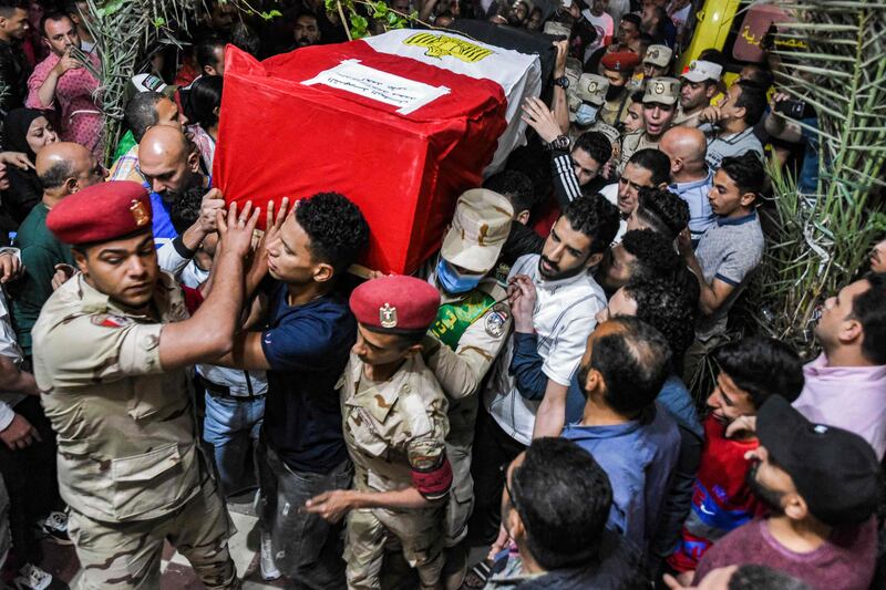 Mourners, soldiers and military police carry the casket of Egyptian Ahmed Mohamed Ali, one of 11 soldiers killed in an attack claimed by ISIS in the Sinai Peninsula. AFP